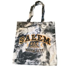 "Salem Witch City" tote bag with a tie-dye pattern and an occult-themed graphic